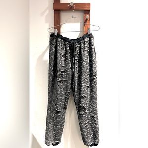Free People Sequin Pants in the color silver and black, size large.